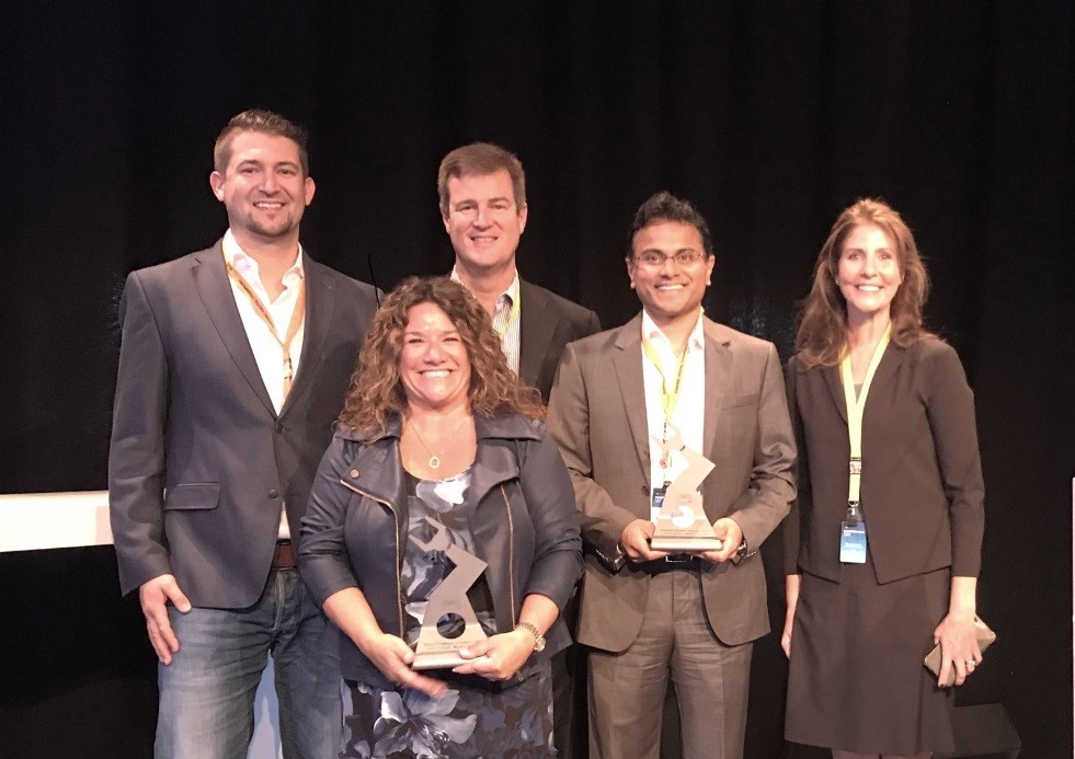 Siemens PLM Software’s Teamcenter and MindSphere teams posing with awards for the AWS Industrial Software Competency with Josef Waltl (left), Global Segment Lead for Industrial Software at AWS