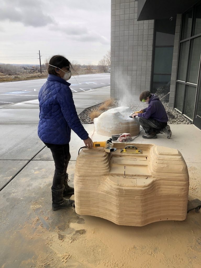 The beginning layer of Bondo applied to the car - some grinding completed. The front portion of the car is in the foreground. (continued)