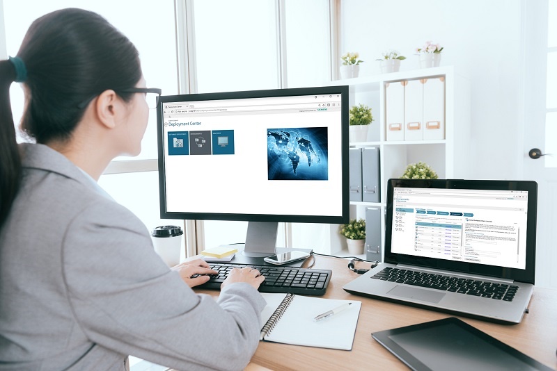 Our PLM Guide to Deployment Center: this image shows a woman working with deployment center on a computer screen