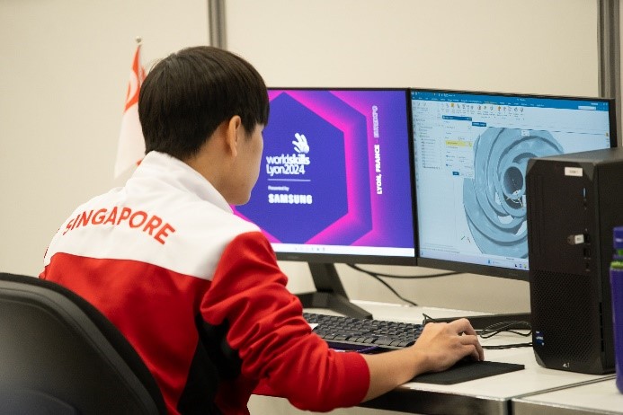 A student uses a computer to design a component as part of the WorldSkills challenge.