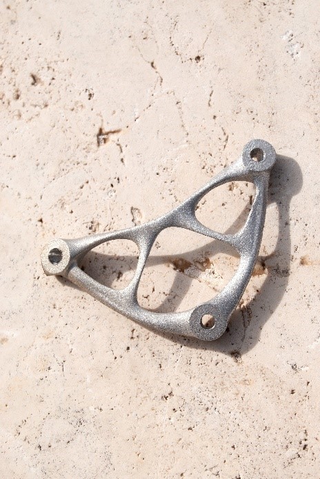 An image of a metal frame designed in Siemens NX and created with additive manufacturing techniques.