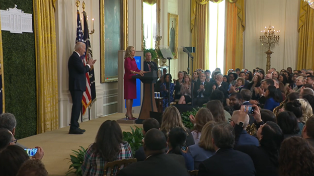 First Lady Jill Biden addresses a crowd in the White House.