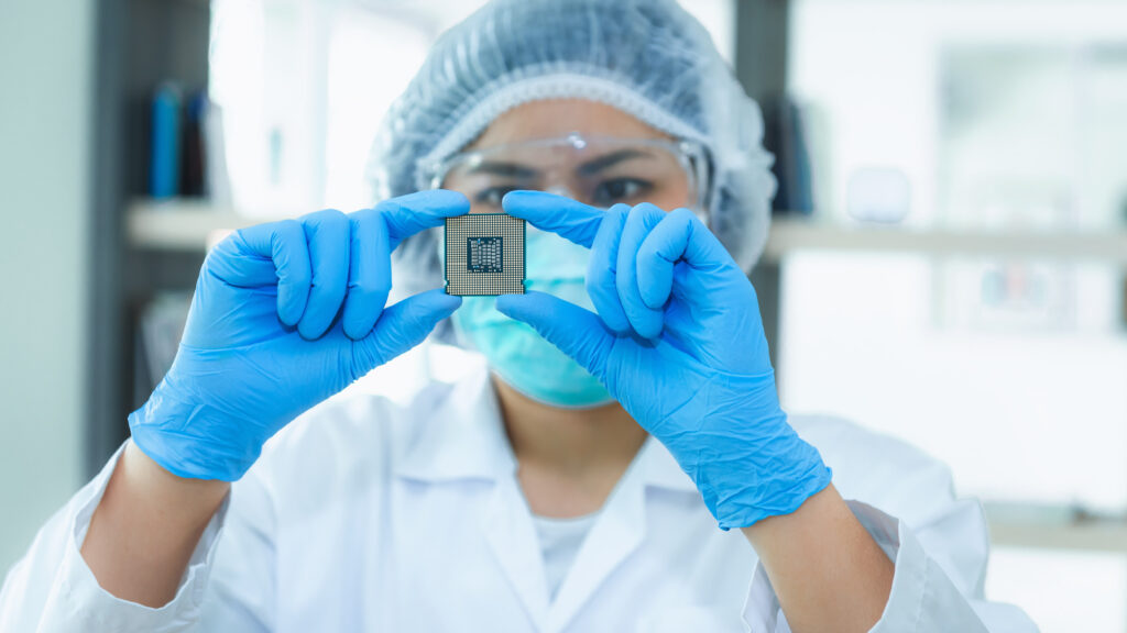 scientist with semiconductor chip
