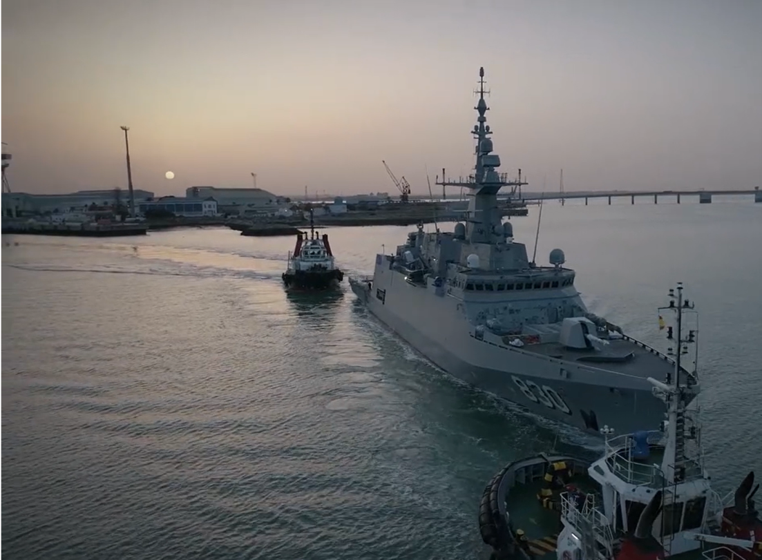 Model-based systems engineering example showing Navantia military ship at sunset.