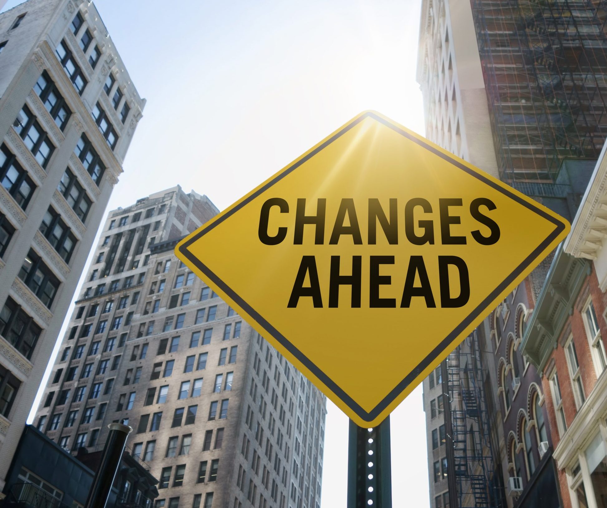 Traffic sign in a city that says "changes ahead". 