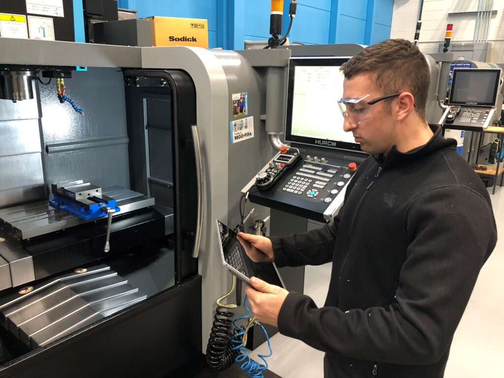 Man managing a machine shop process.