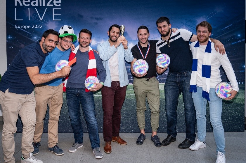 getting a photo with fellow innovators at the football gathering at realize live europe