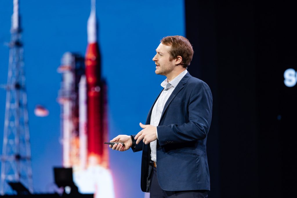 Mainstage presenter with rocket speed behind