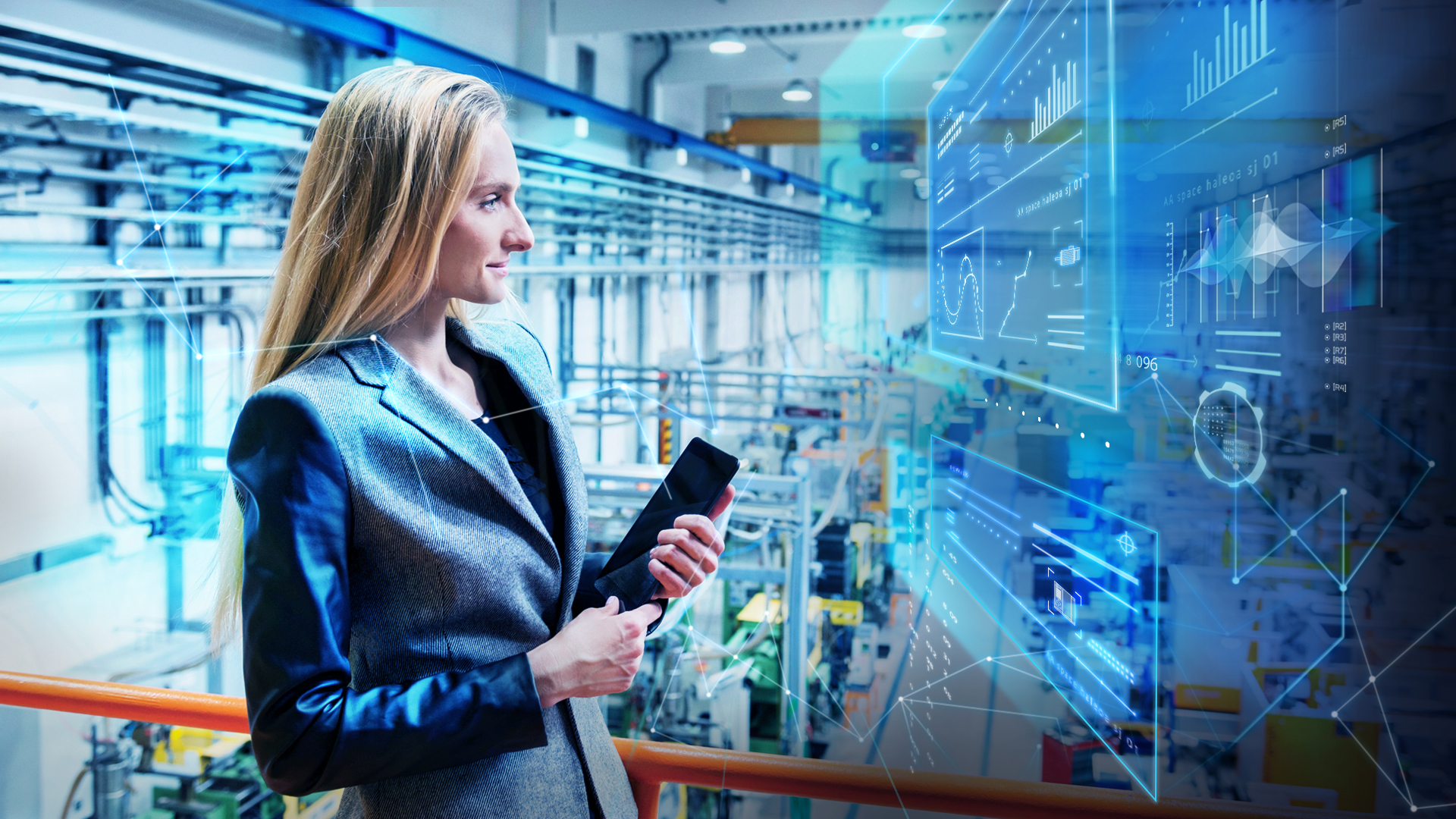 Employee checking IoT data on the shop floor