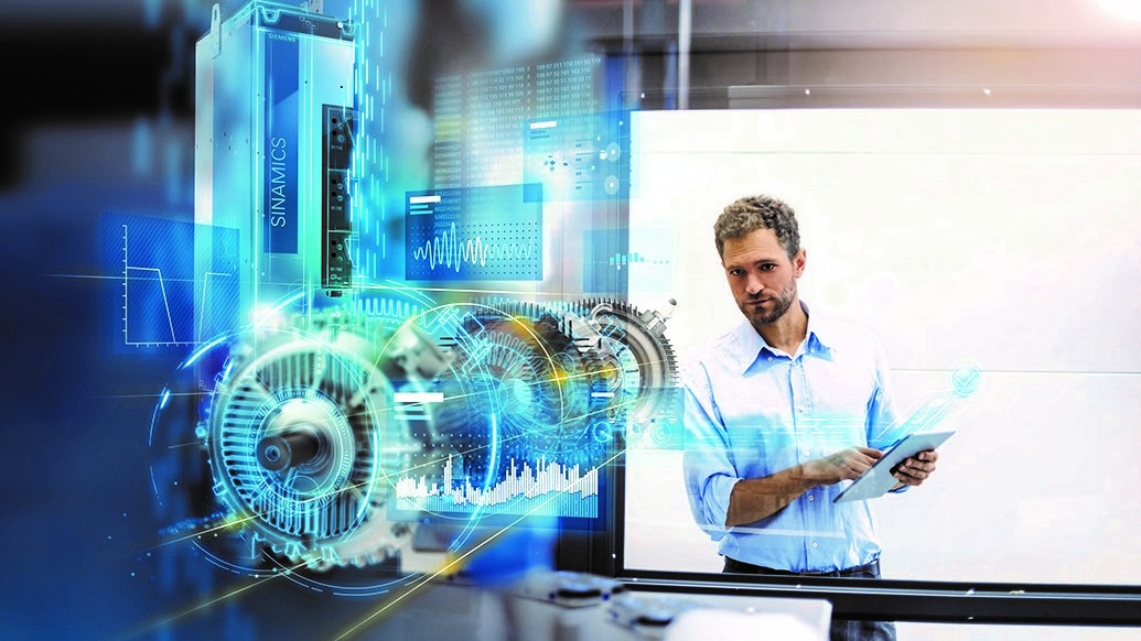 Employee examining motor in factory for optimizations