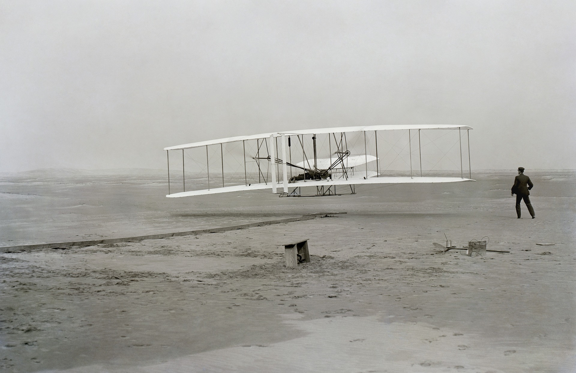 The Wright brothers' Flyer taking off at Kitty Hawk, North Carolina.