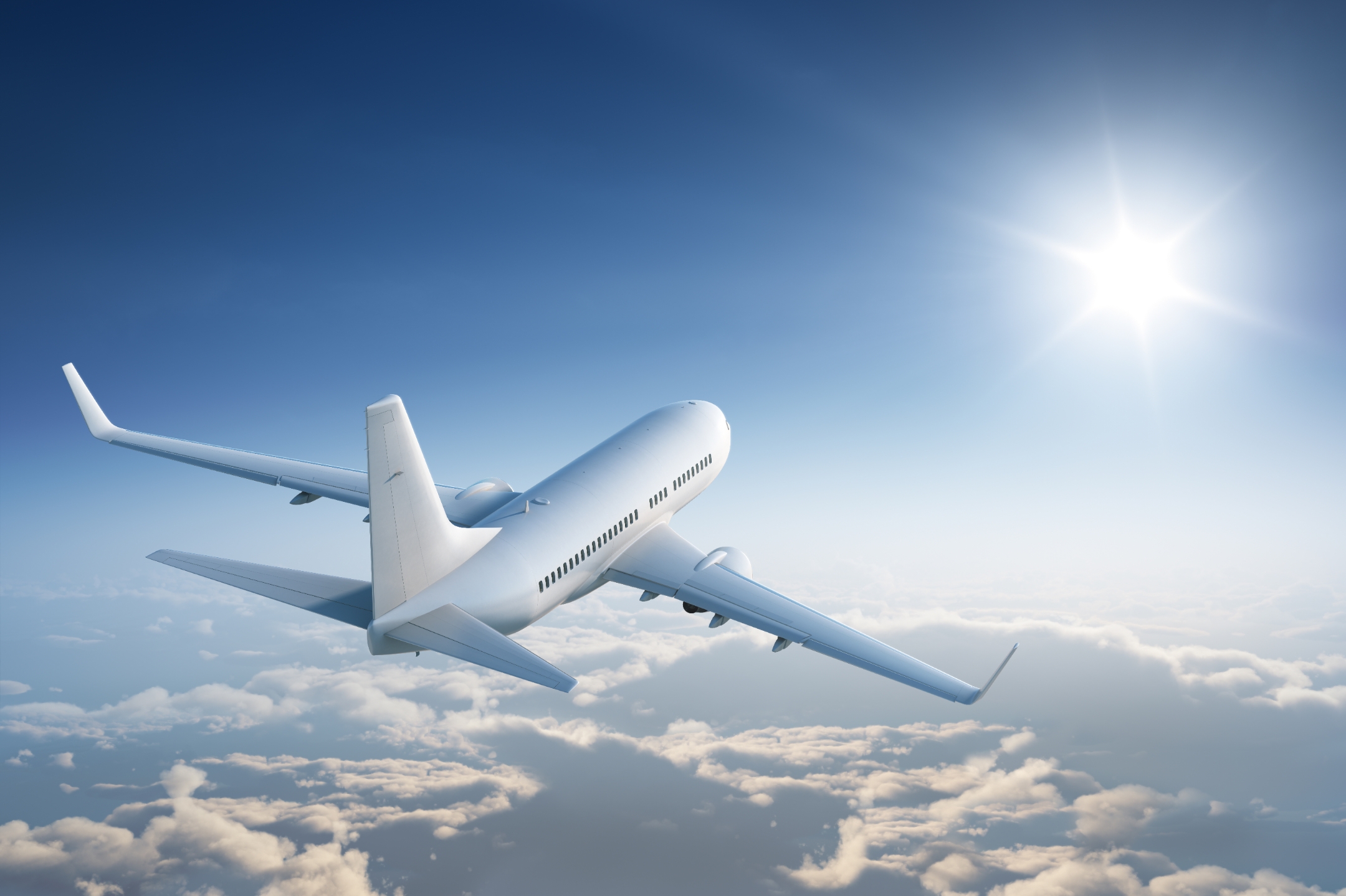 Airplane flying above the clouds.