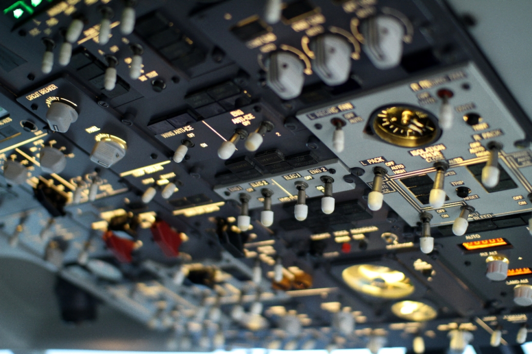 A dashboard filled with flight instruments in a jet cockpit.