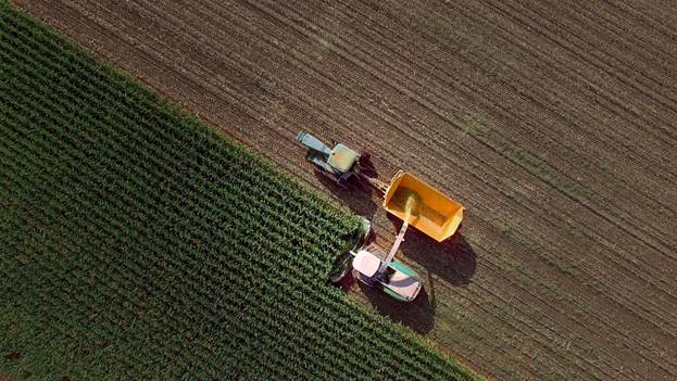 A tractor harvesting a field.