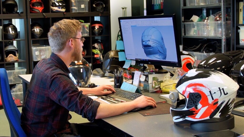 Alexandre Gilbert works details of the latest helmet design.