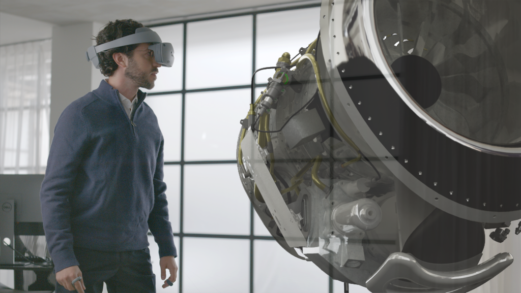 The image shows someone using the Sony HMD viewing an aircraft engine.