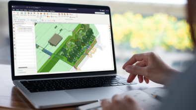 A person on a laptop using Designcenter software