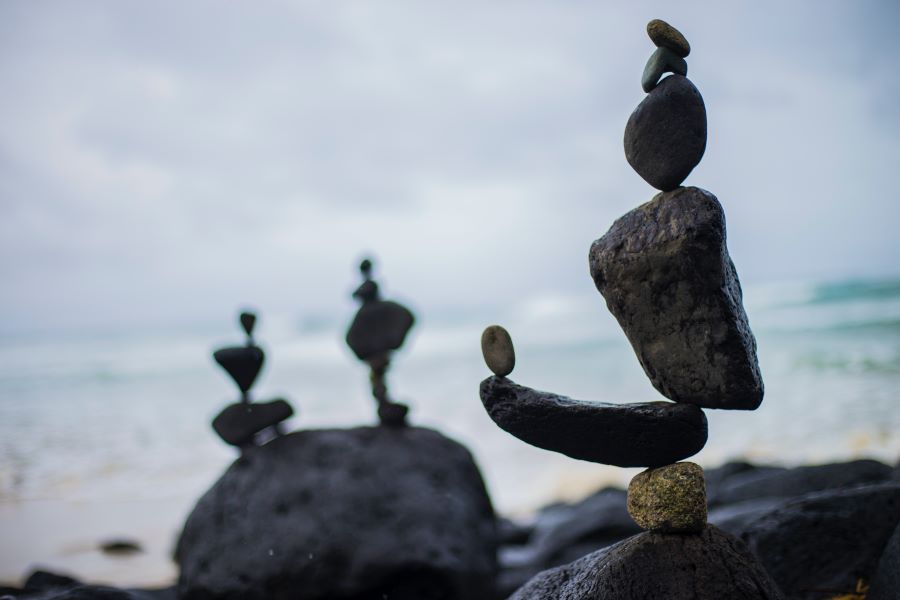 multiple rock cairns balancing other rocks