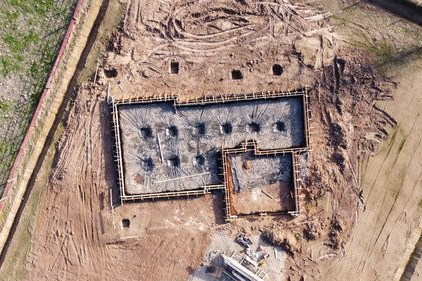 An aerial view of a new home construction's foundation. Sustaira's low-code Sustainability and ESG app provides the foundation on which to build.