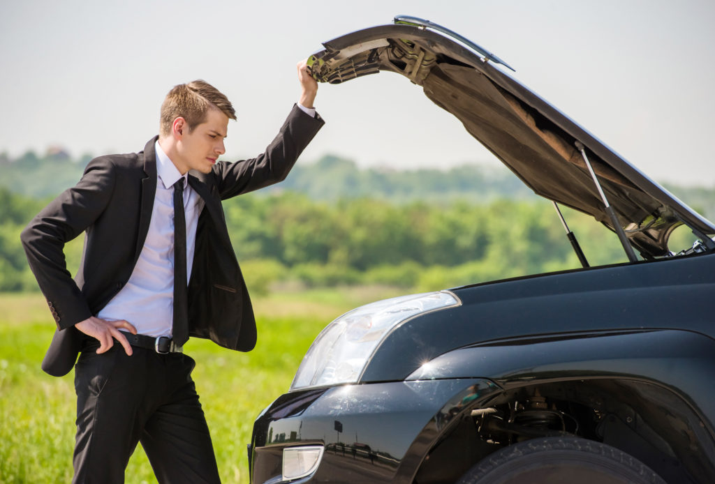 Man dressed in professional attire looking under hood of an engine. But with automated service documentation he won't be waiting long to get his repairs done right. Capital software can increase service efficiency, reduce vehicle downtime, and preserve the company’s brand image through high levels of customer satisfaction.