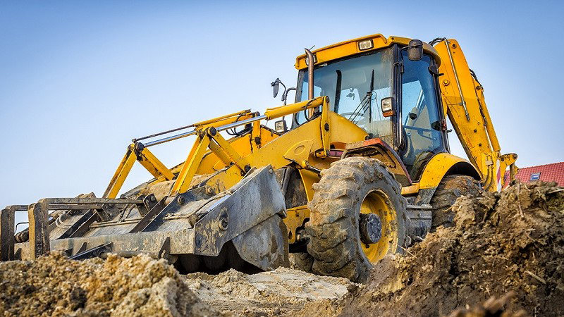 Image of a heavy equipment bulldozer at a worksite