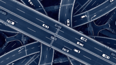 cars driving around a traffic interchange