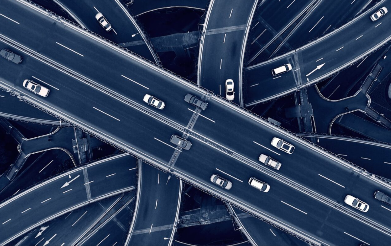cars driving around a traffic interchange
