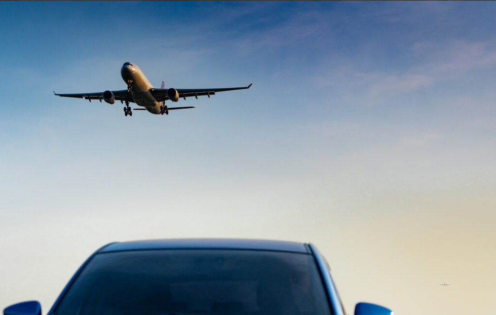 an airplane above a car