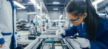 Electronics manufacturer inspects components including a printed circuit board