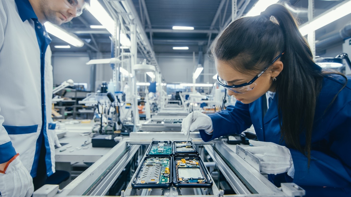 Electronics manufacturer inspects components including a printed circuit board