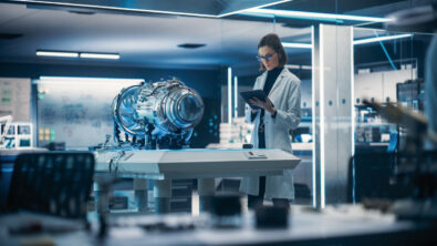 An aerospace engineer works on the design of an aircraft part