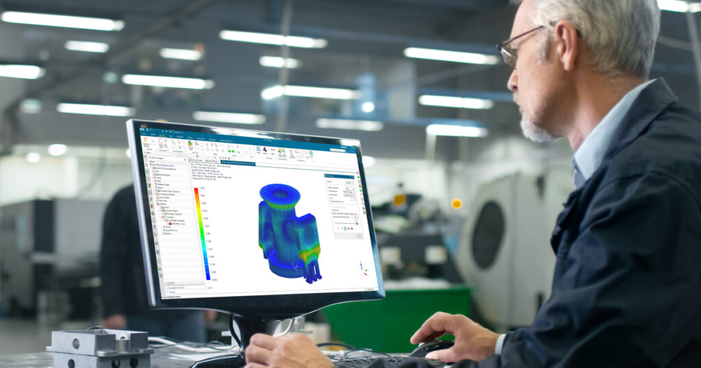 An engineer uses simulation to analyze an industrial machine component.