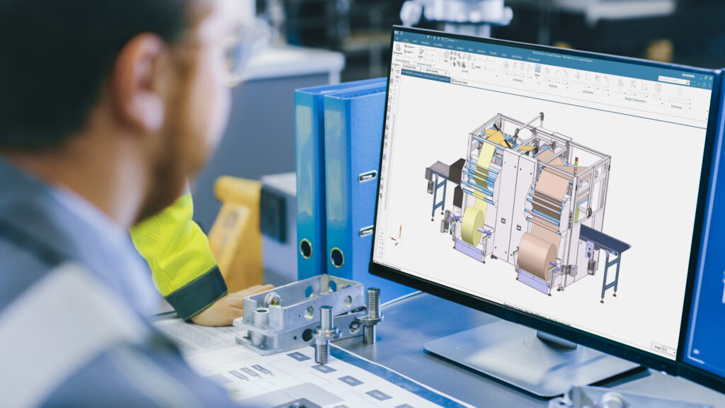 An engineer looks at a multi-domain system simulation of an industrial machine on his computer screen.