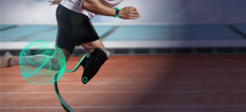 Male runner running on track in prosthetic leg