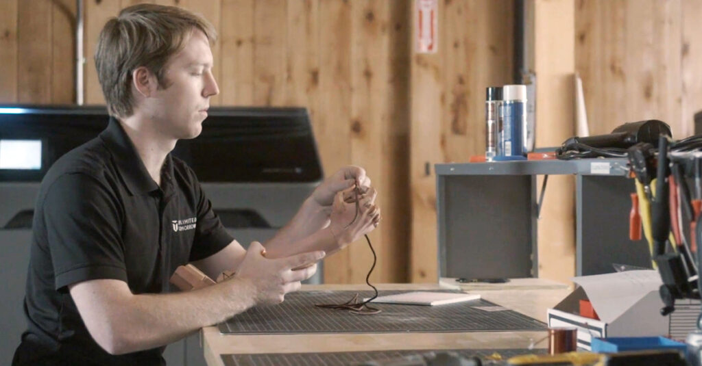 Easton LaChappelle, CEO and Founder of Unlimited Tomorrow, working on a prosthetic limb.