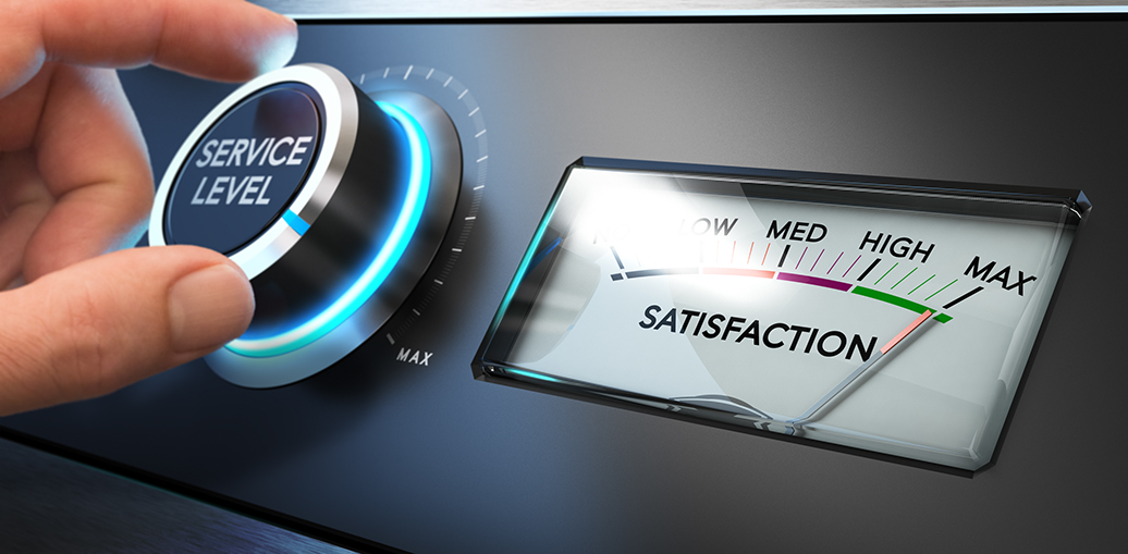 Hand turning a service level knob up to the maximum with a dial where it is written the word satisfaction. Concept image for illustration of how Advanced Planning and Scheduling APS can impact on-time delivery and customer satisfaction.