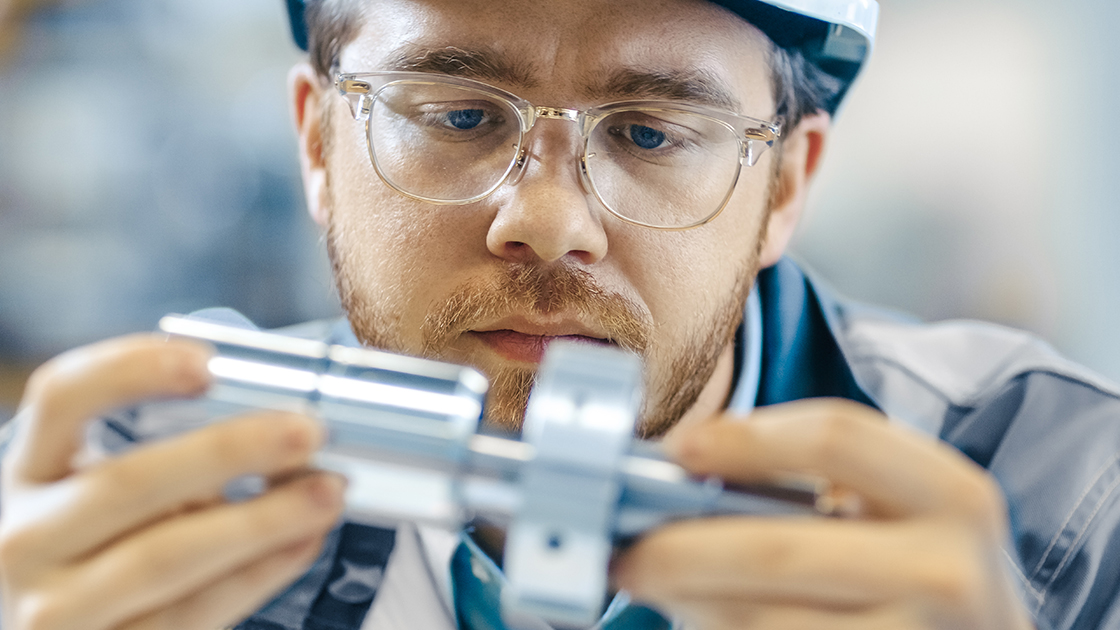 Man performing an inspection as part of a quality control process.