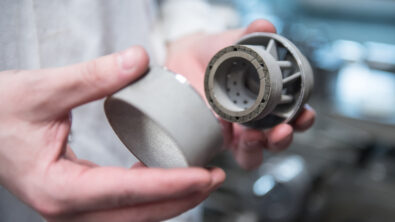 3D-printed gas turbine burner heads for commercial power plant operation