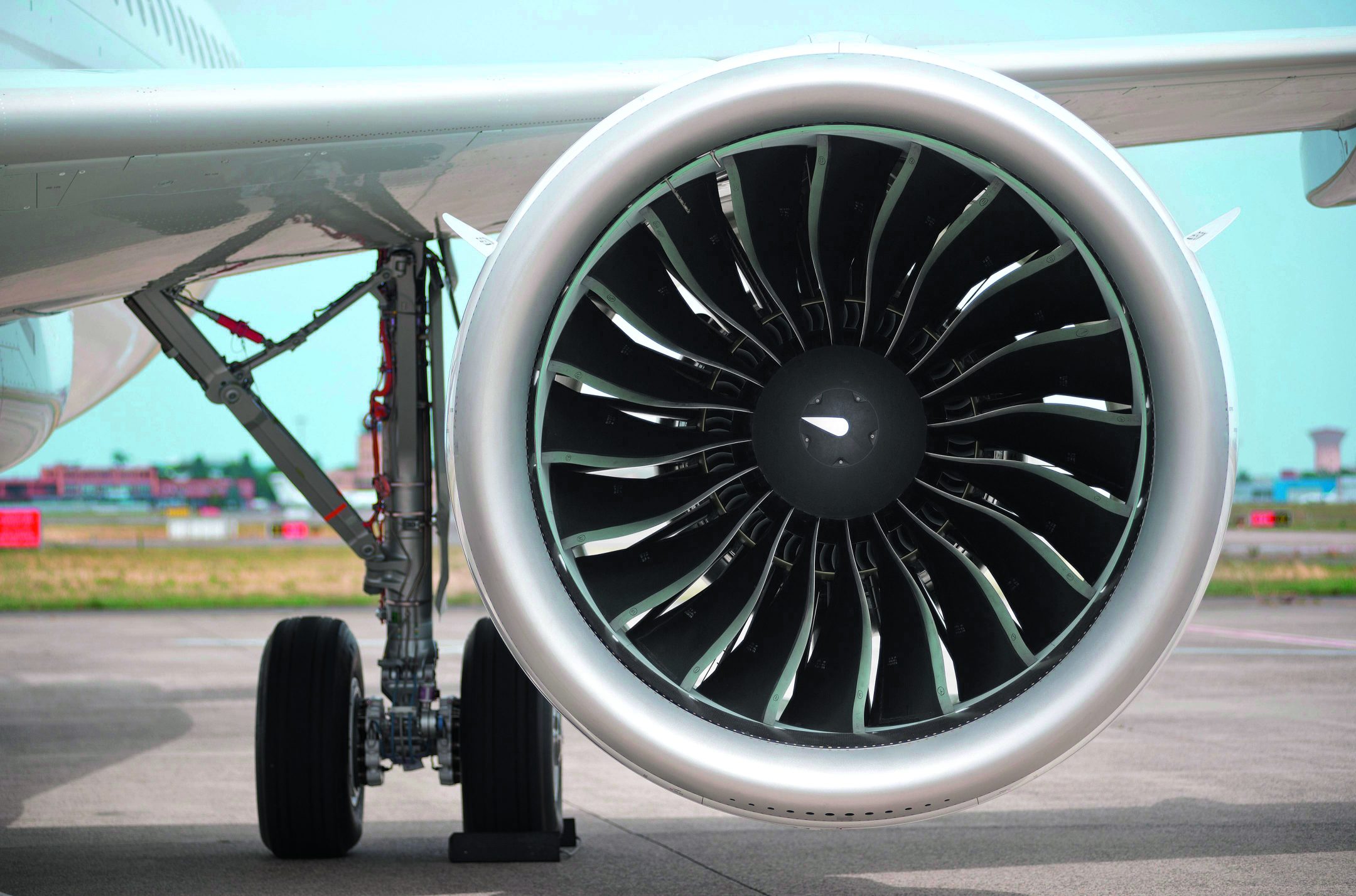 A close-up of an airplane jet turbine from the front.