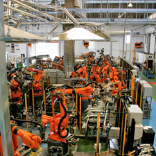 Automated robots on the production floor of a manufacturing plant