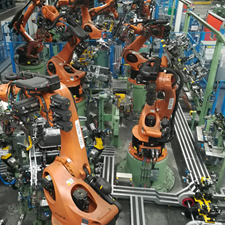 Manufacturing robots arranged on an automated assembly line