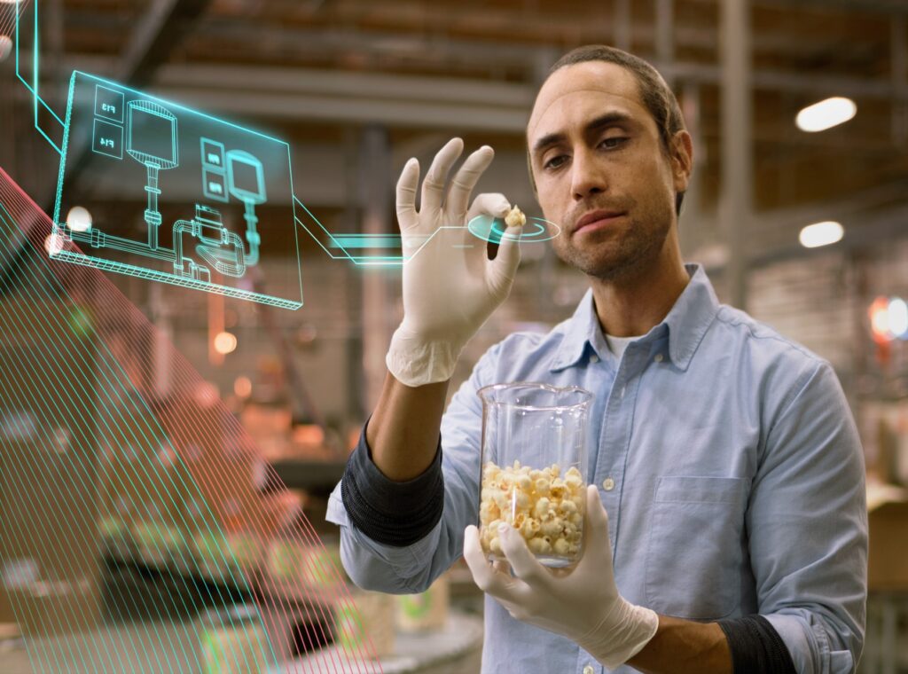Personalized consumer products- man holding popcorn with digital layer