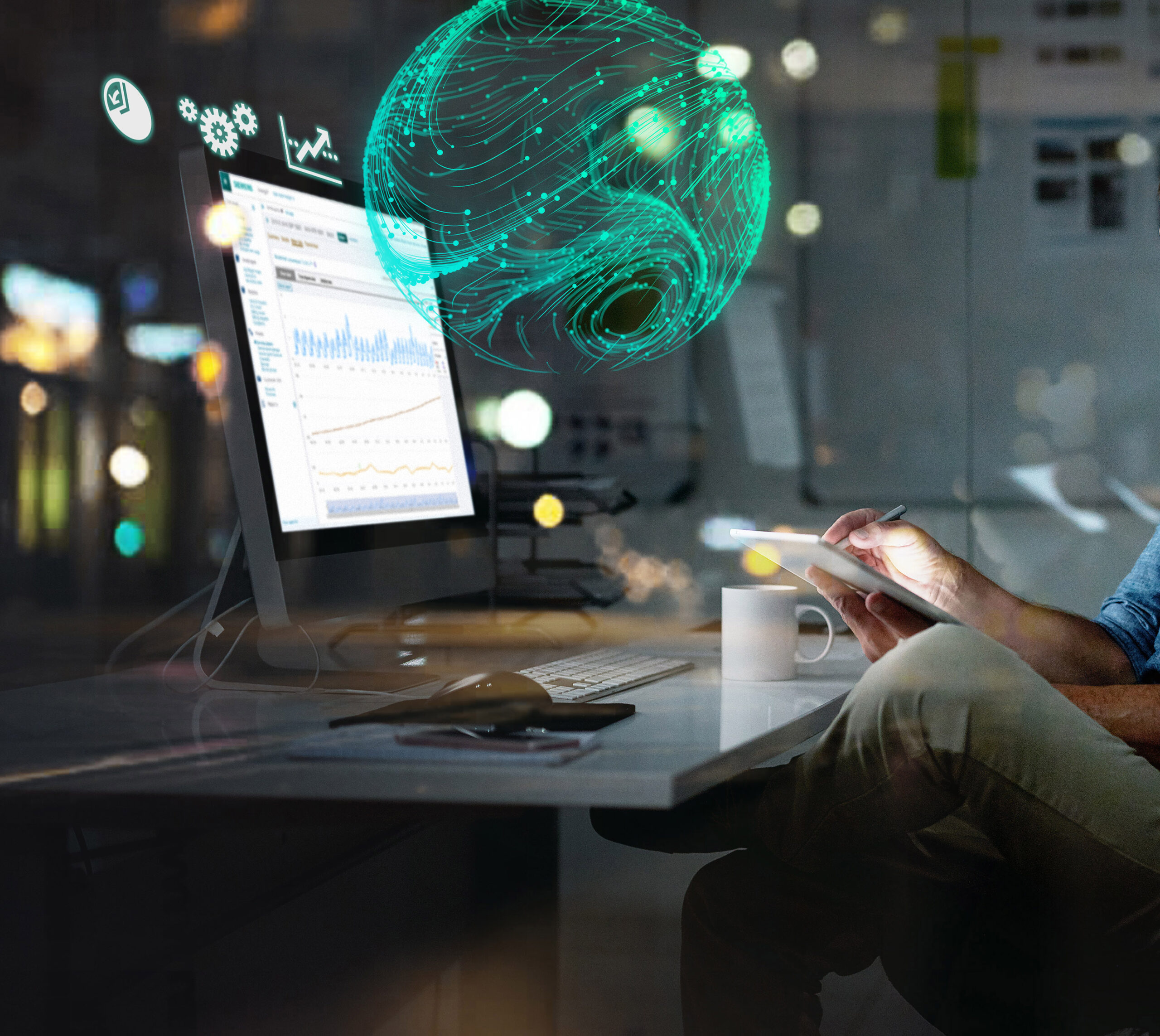 Person working in front of computer screen at night, with digital overlay of green-colored globe..