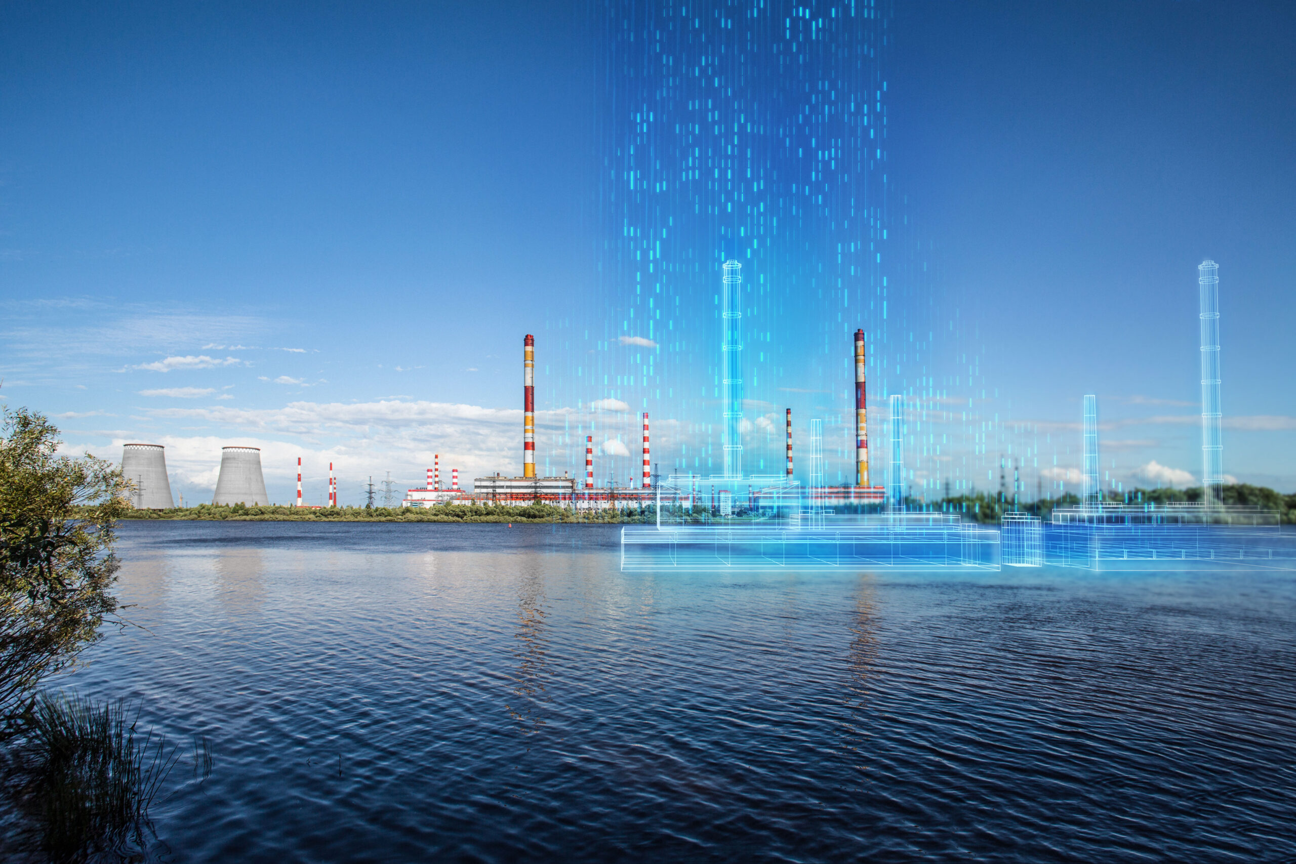 Nuclear power plant across water with digital overlay and blue sky.
