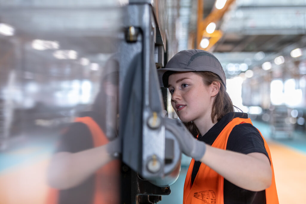 Female service technician servicing an asset.