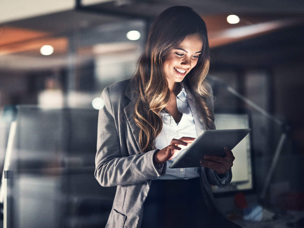 A stakeholder using SaaS application on a tablet to access information