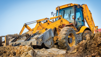 Heavy equipment moving earth on a construction site
