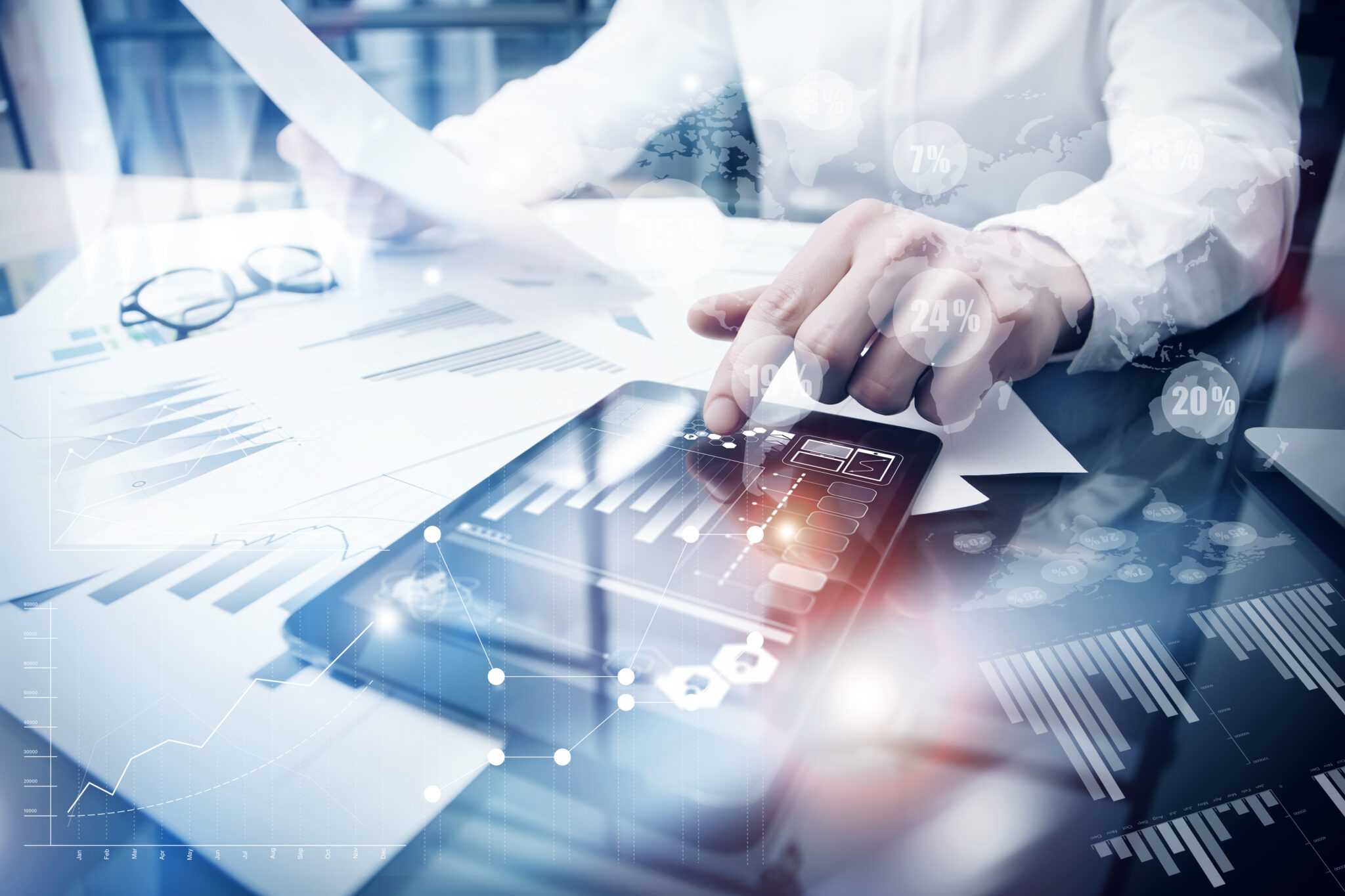 businessman using a tablet--close-up of his hands on the tablet.