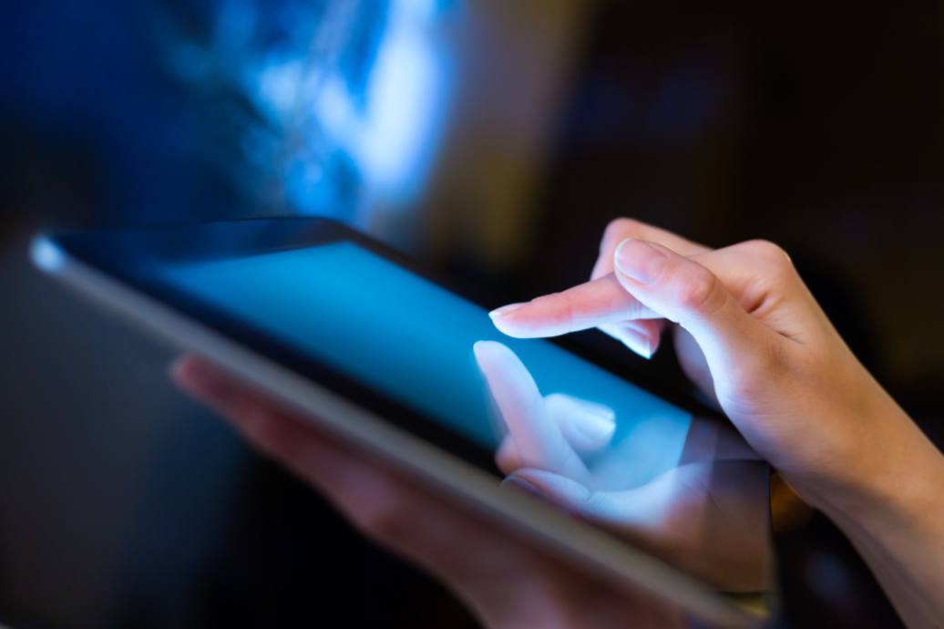 Close-up of a hand using a tablet