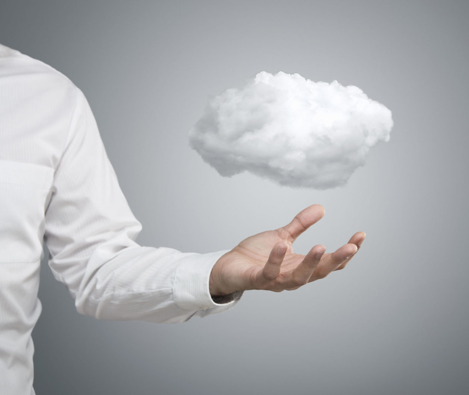 A man's outstretched arm with a cloud floating above it